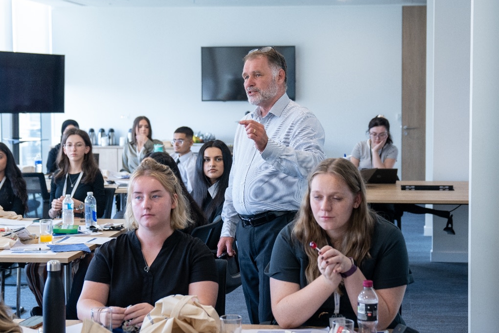 A team leader giving a talk at an apprenticeship meeting